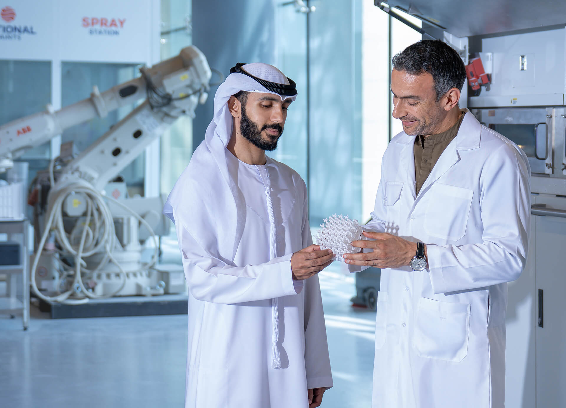 Two scientists check a 3D printed model at SoiLab